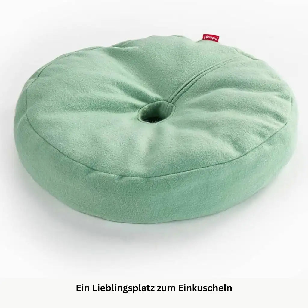 Rundes hellgruenes Katzenbett mit weicher Oberfläche