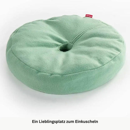 Rundes hellgruenes Katzenbett mit weicher Oberfläche