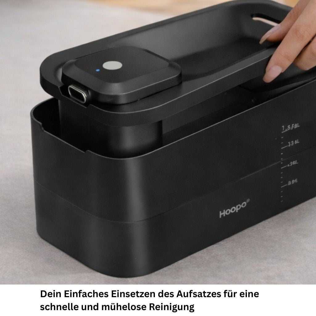 Schwarzer Trinkbrunnen wird von Hand zusammengesetzt